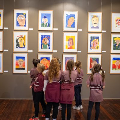 Eudunda Area School student artists visit to Heart and Soul of the Country at Burra Regional Art Gallery - looking for their self portraits.
